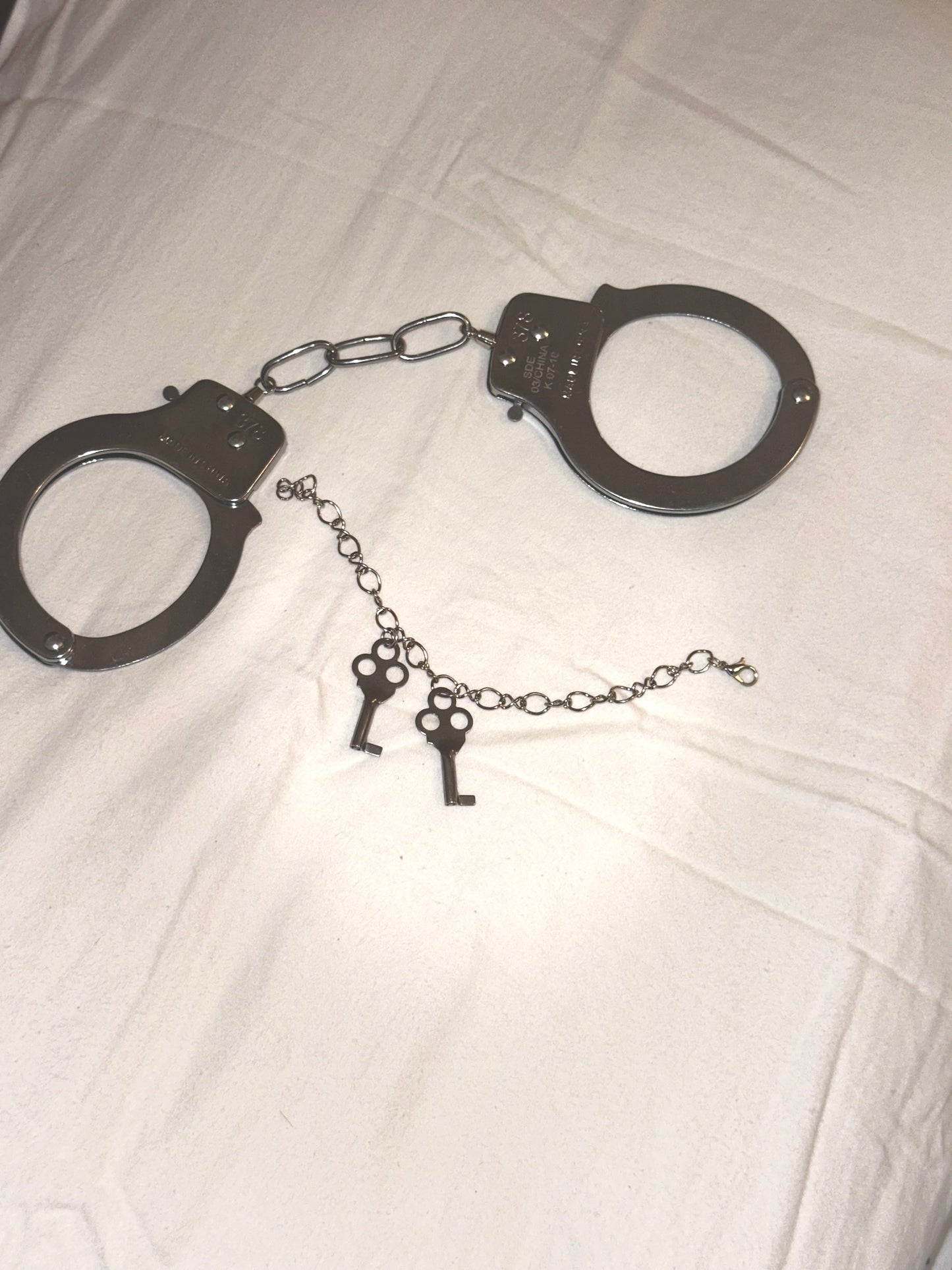Handcuff keys bracelet
